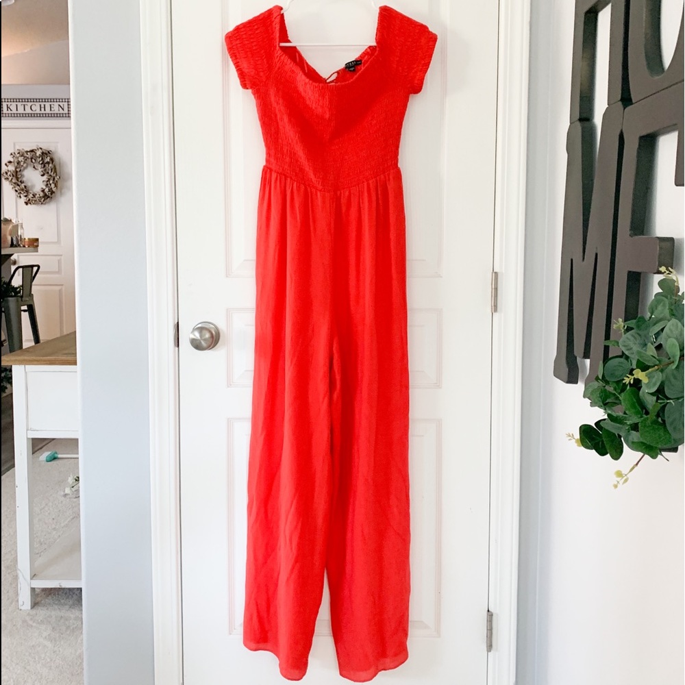 Red medium guess romper with lace up back